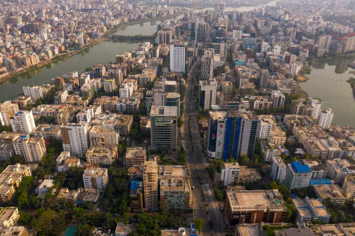 aerial-view-of-a-large-city-road-crossing-the-residential-district-at-sunset-in-dhaka-bangladesh-AAEF11017